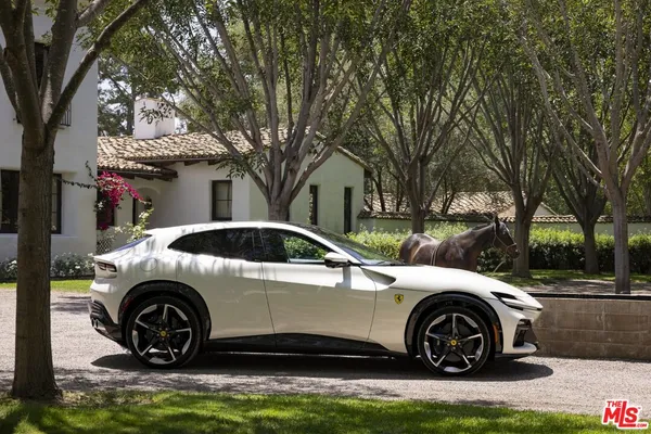 a view of a car parked in front of a house
