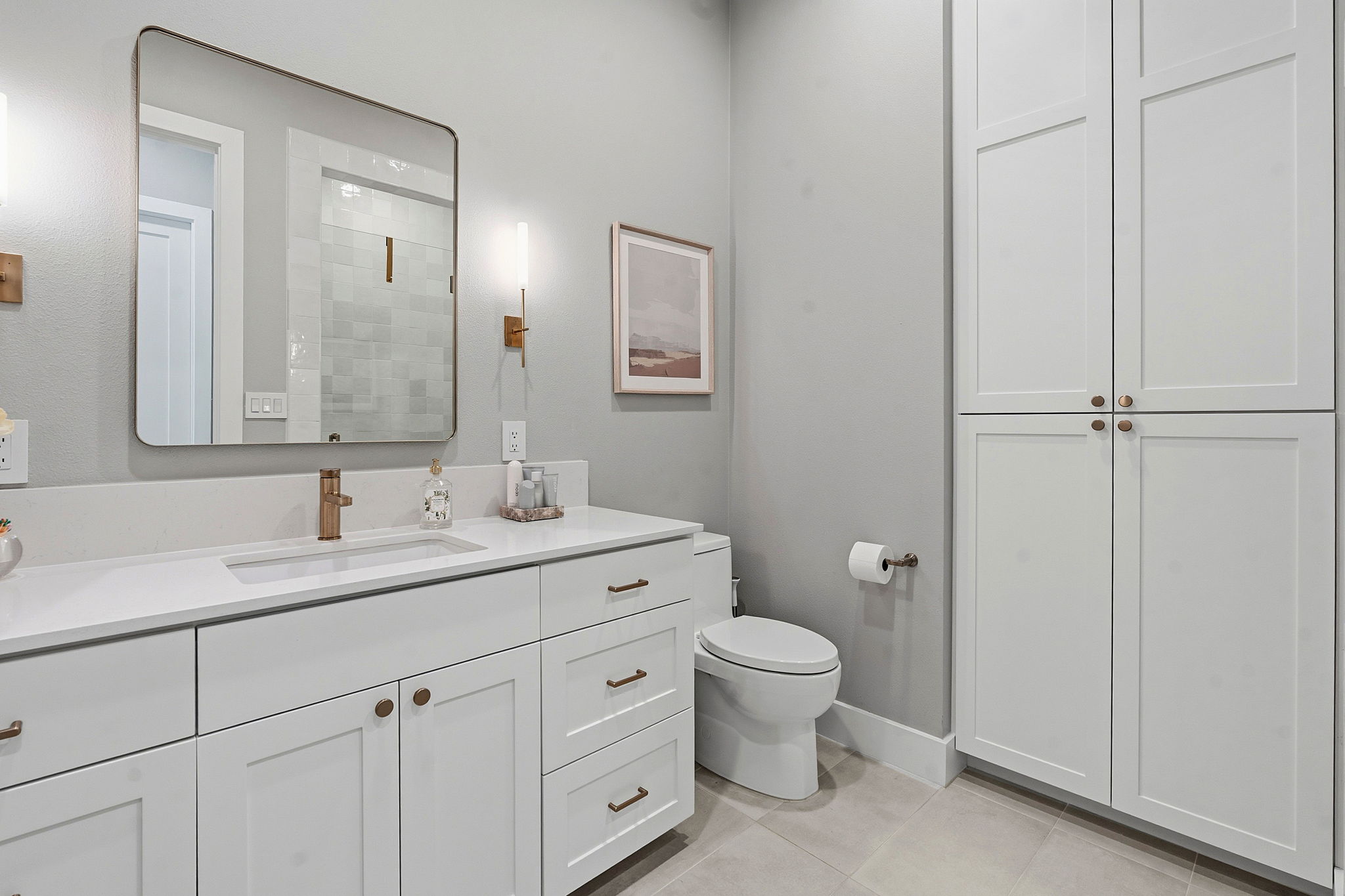 11501 Turtle Lane Austin, TX 78726 - Photo 29 of 37 a bathroom with a granite countertop toilet a sink and a mirror