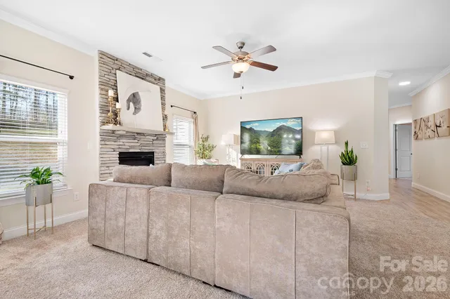 a living room with furniture and a fireplace