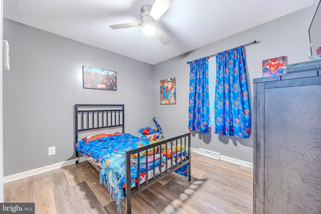 a bedroom with furniture and a chandelier