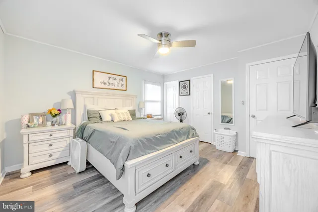 a bedroom with a bed and a dresser