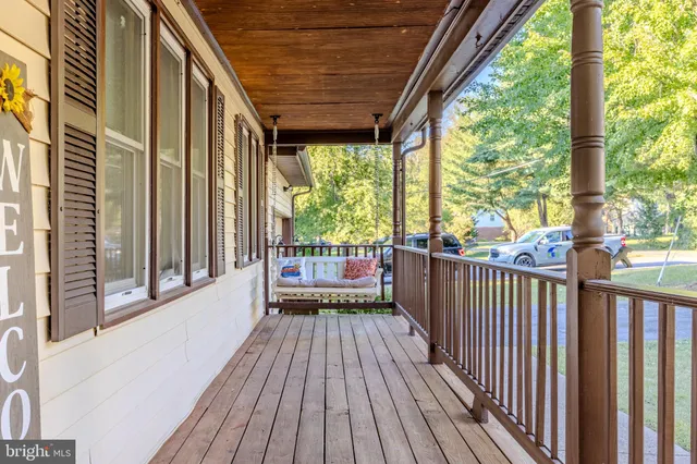a view of a balcony with wooden floor