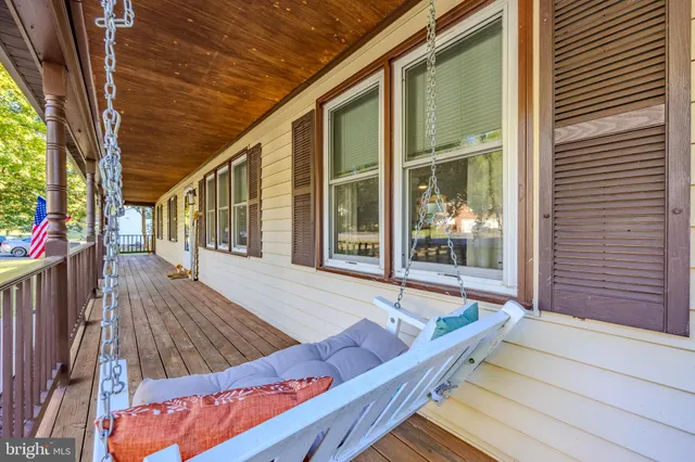 a view of swimming pool with outdoor seating