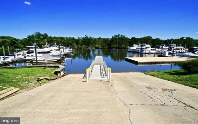 a swimming pool with outdoor seating and yard