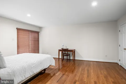 a bedroom with a bed and a table