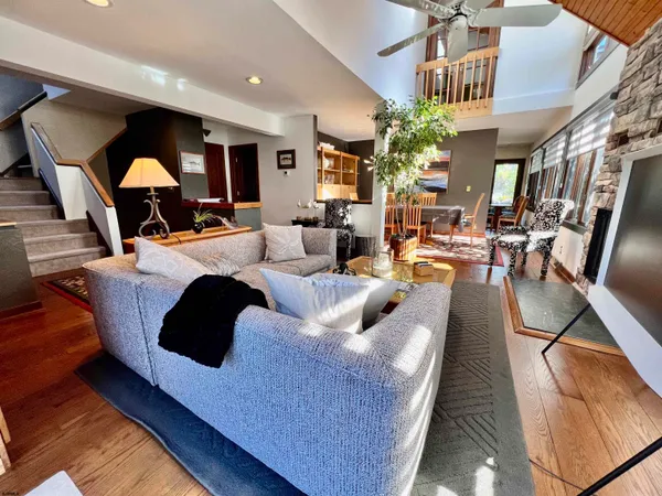 a kitchen with stainless steel appliances kitchen island granite countertop a stove sink and cabinets