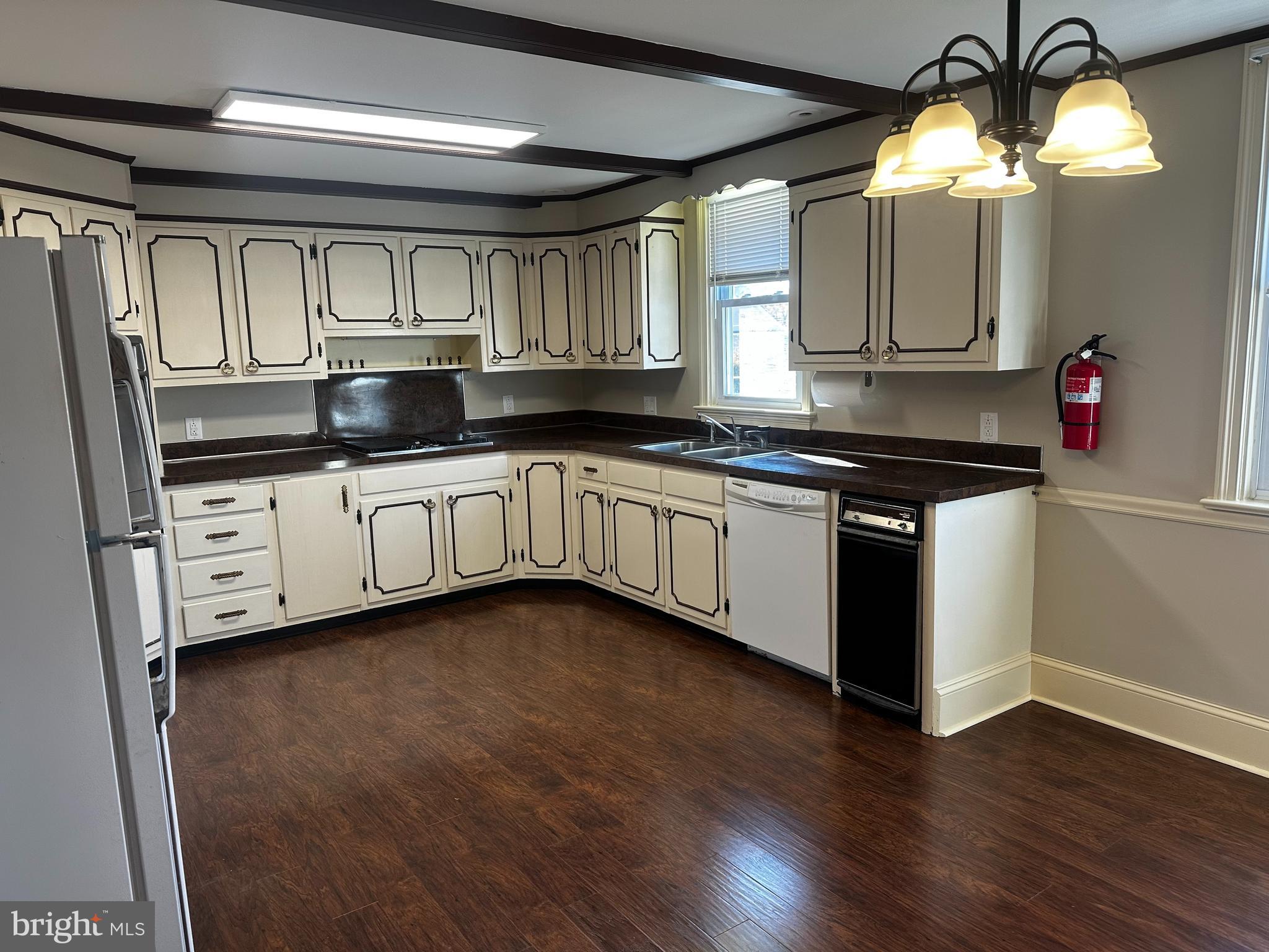 659 North Main Street Doylestown, PA 18901 - Photo 12 of 22 a kitchen with granite countertop a sink and cabinets