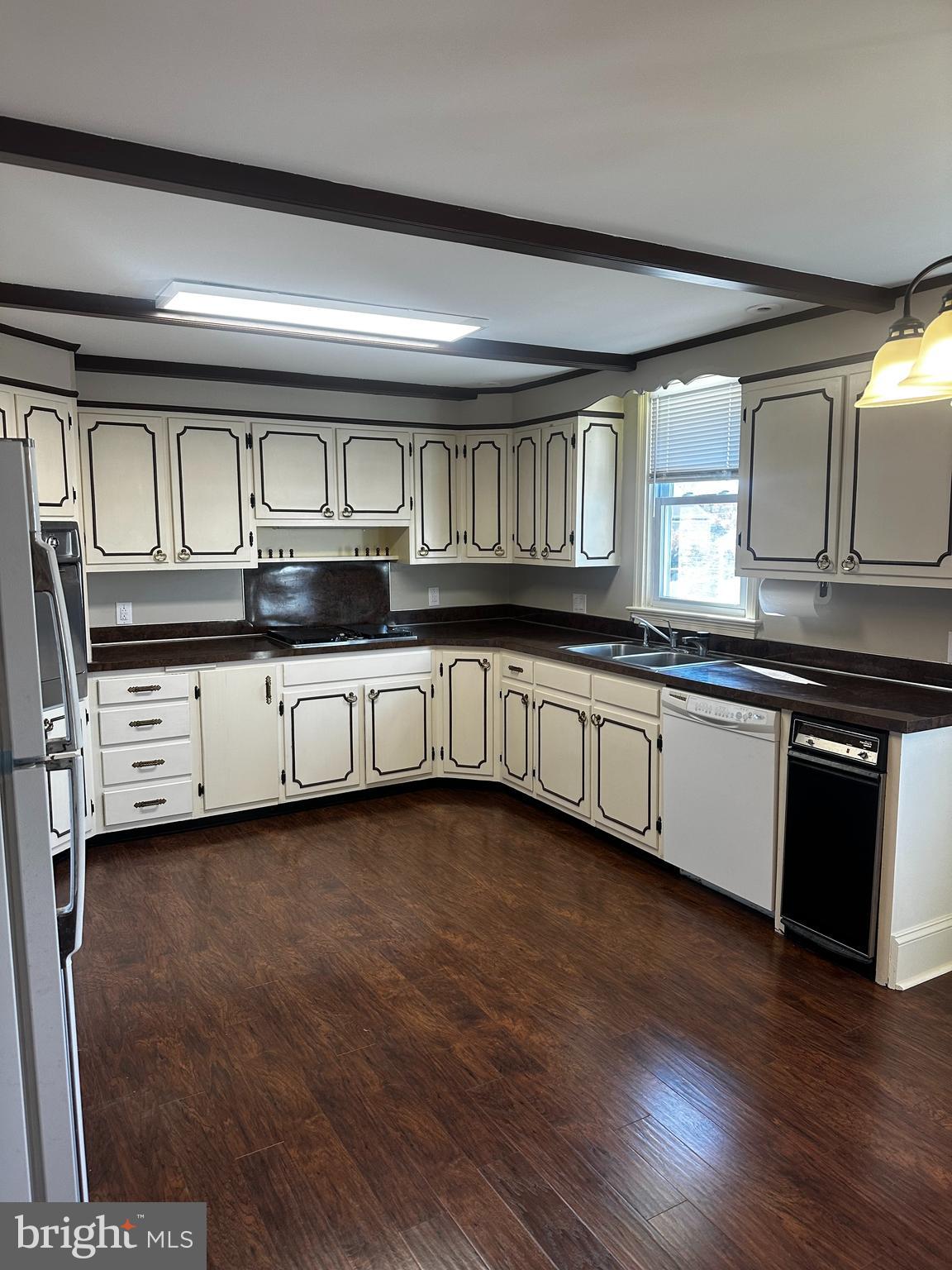 659 North Main Street Doylestown, PA 18901 - Photo 4 of 22 a kitchen with granite countertop a sink and cabinets