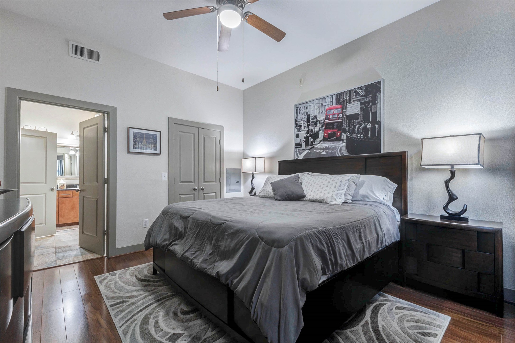 1901 Post Oak Boulevard, Unit 1106 Houston, TX 77056 - Photo 16 of 26 a bedroom with a bed and a chandelier