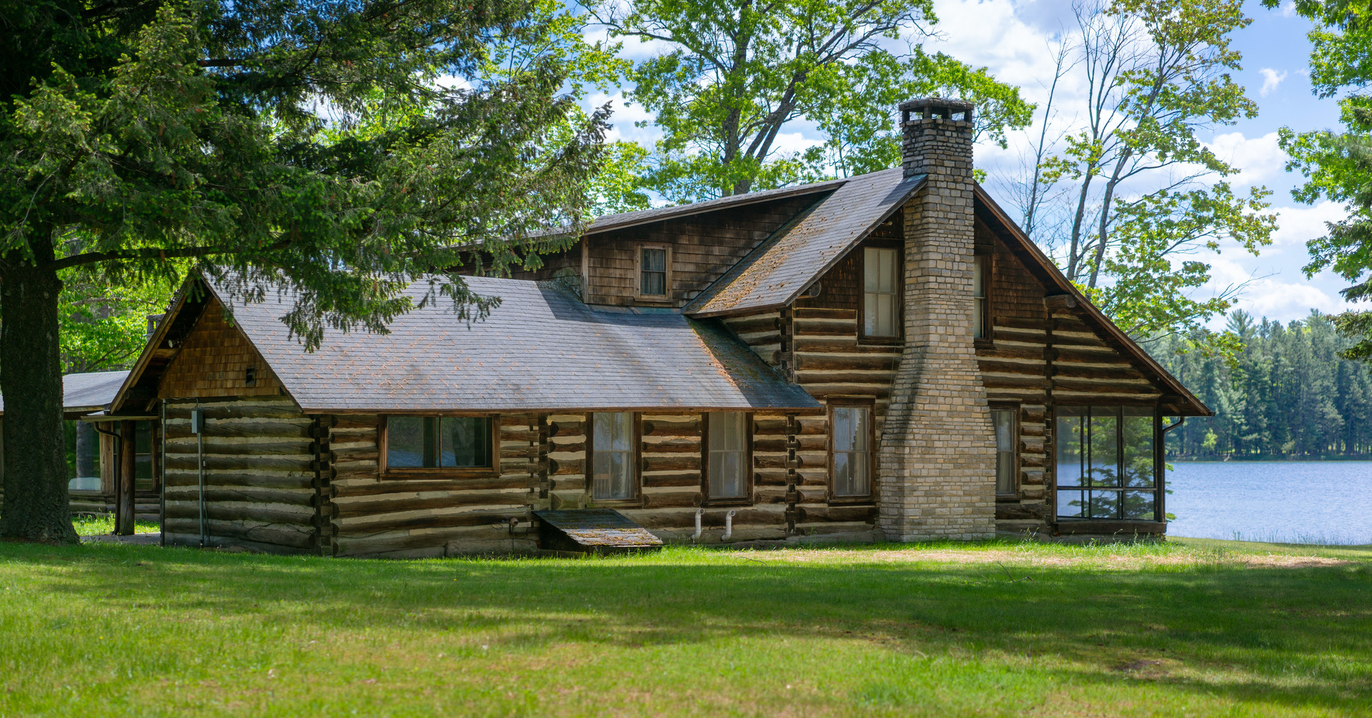 5021 Solomon Road Atlanta, MI 49709 - Photo 20 of 34 a front view of a house with a garden