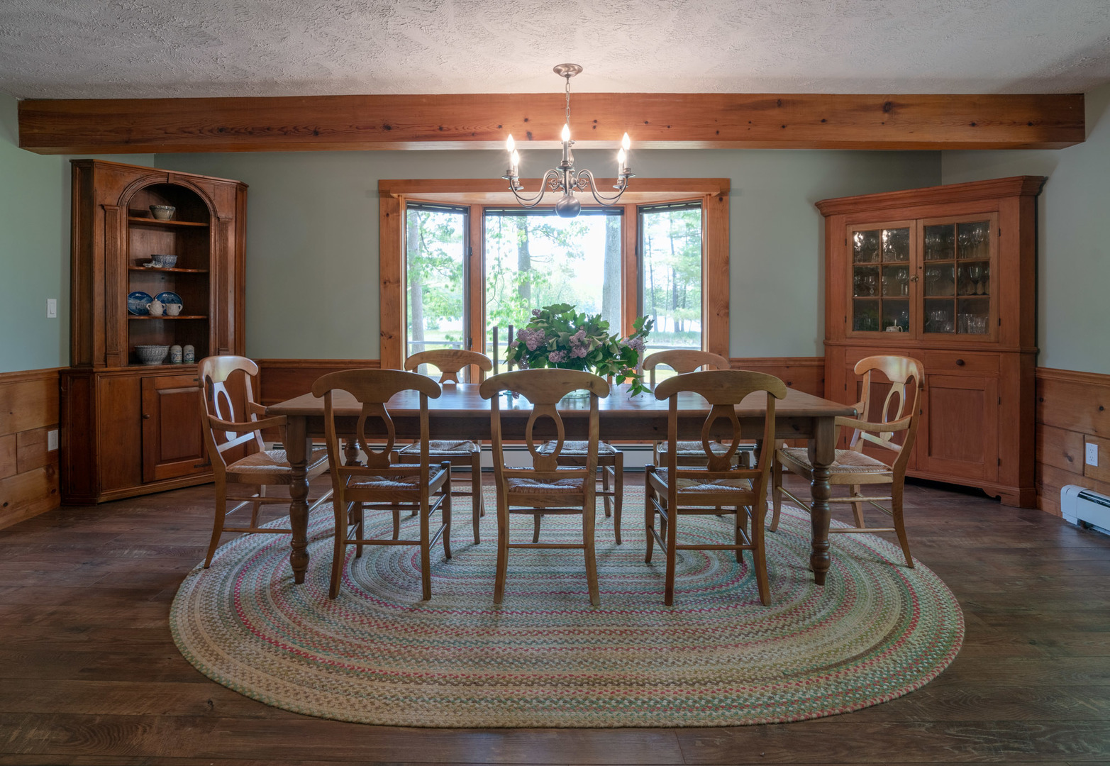 5021 Solomon Road Atlanta, MI 49709 - Photo 7 of 34 a dining room with furniture a chandelier and wooden floor