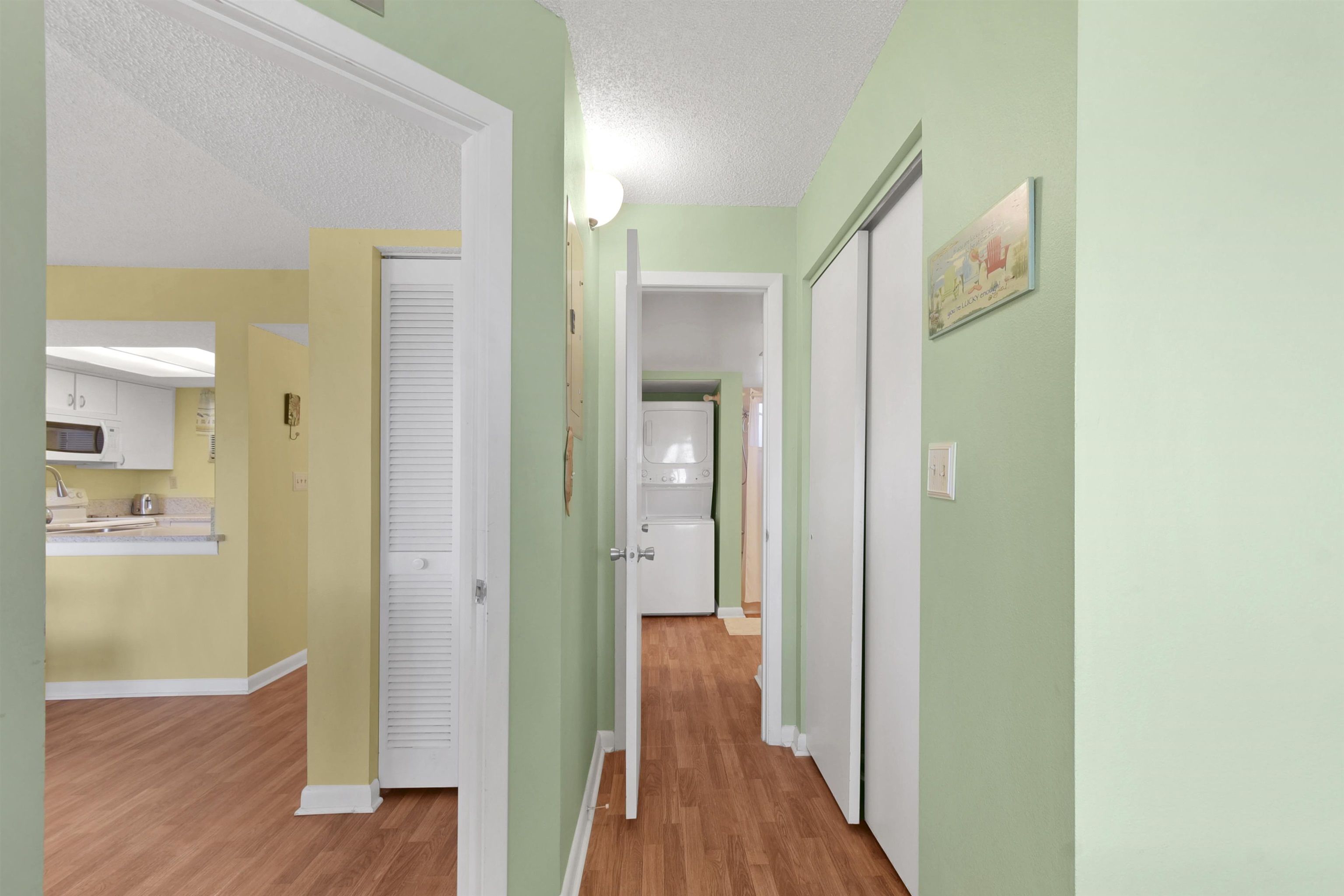 4250 A1A South, Unit C26 St. Augustine, FL 32080 - Photo 17 of 39 a view of a hallway with wooden floor