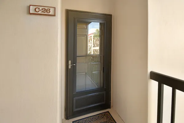 a bathroom with a glass shower door