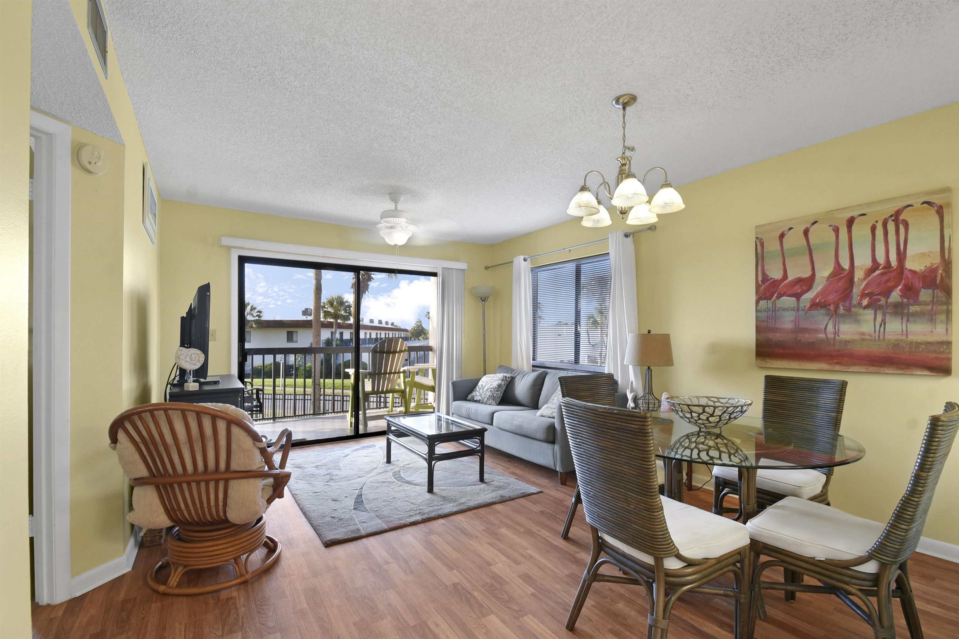 4250 A1A South, Unit C26 St. Augustine, FL 32080 - Photo 3 of 39 a living room with furniture and a floor to ceiling window
