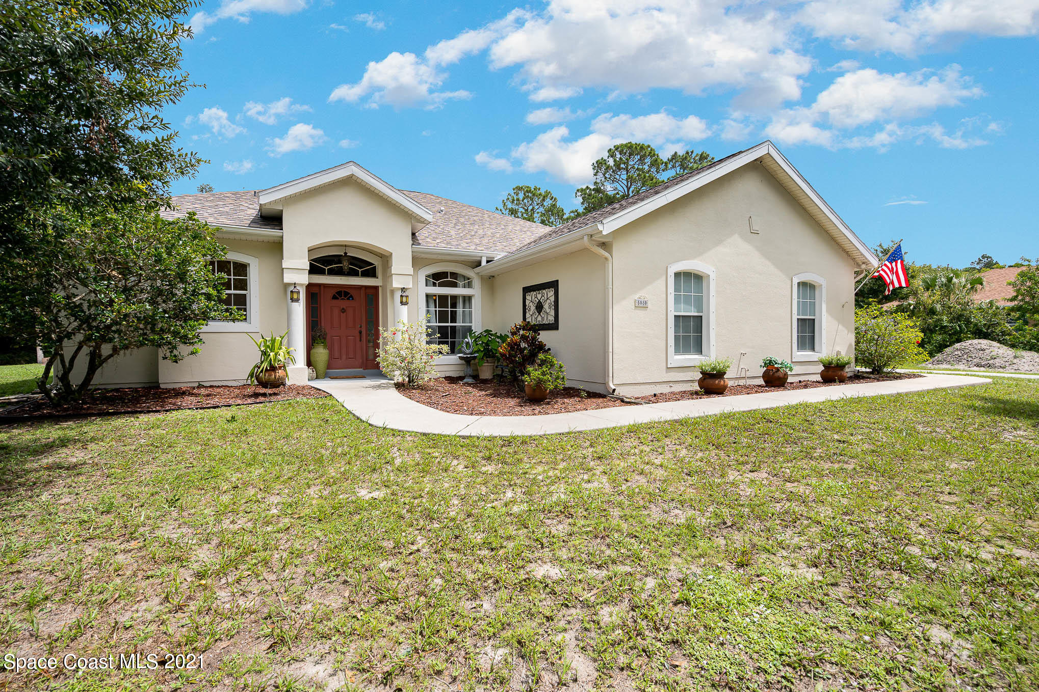 5080 Craig Road Cocoa, FL 32926 - Photo 2 of 41 a view of a house with a yard