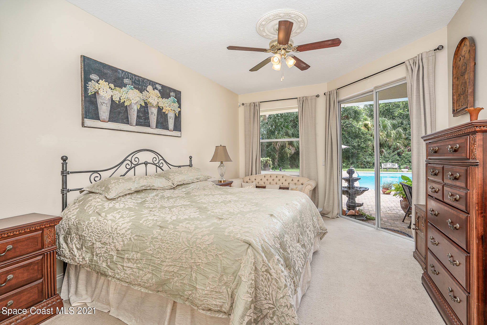 5080 Craig Road Cocoa, FL 32926 - Photo 14 of 41 a bedroom with a large bed and a large window
