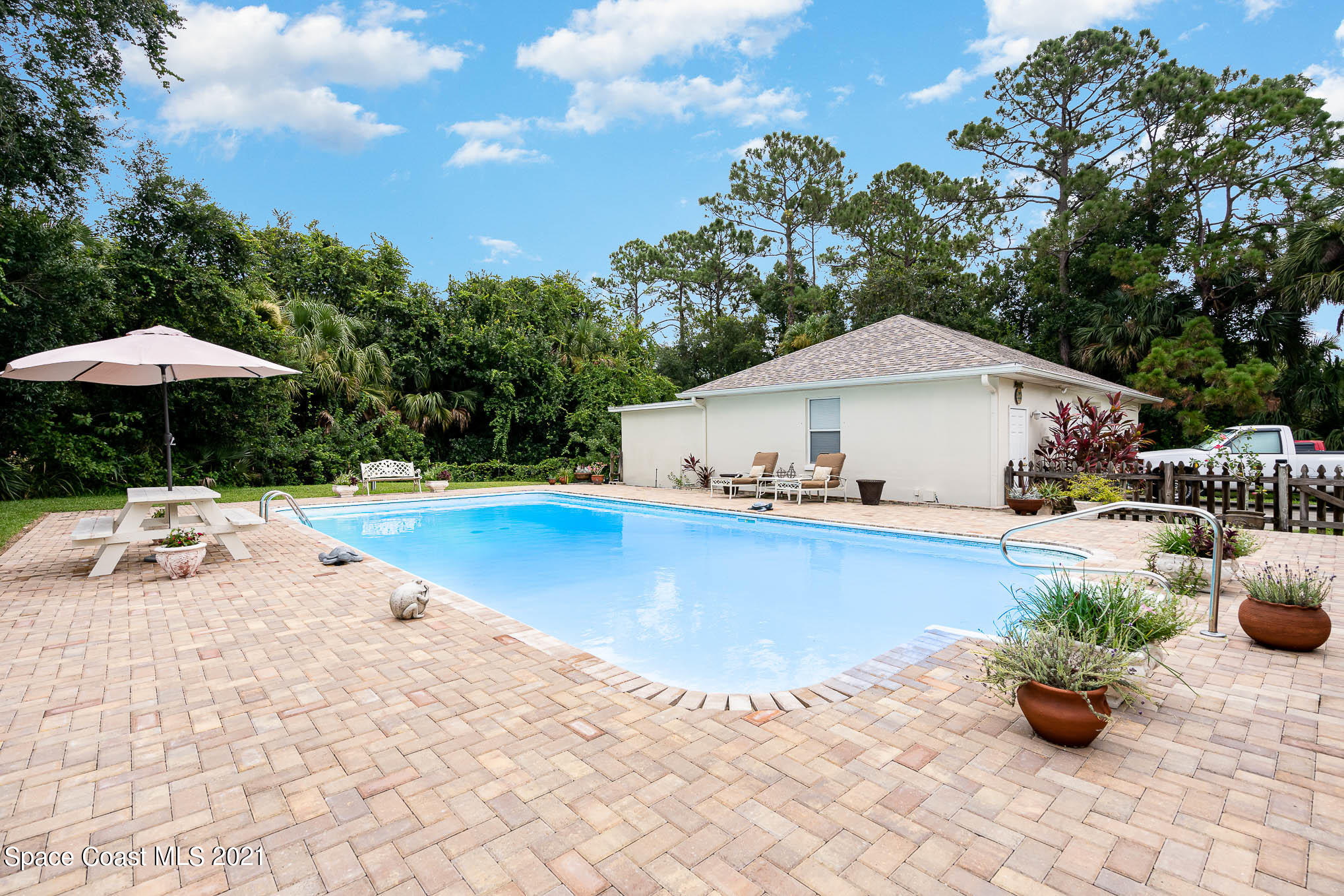 5080 Craig Road Cocoa, FL 32926 - Photo 23 of 41 a view of a terrace with chairs and plants