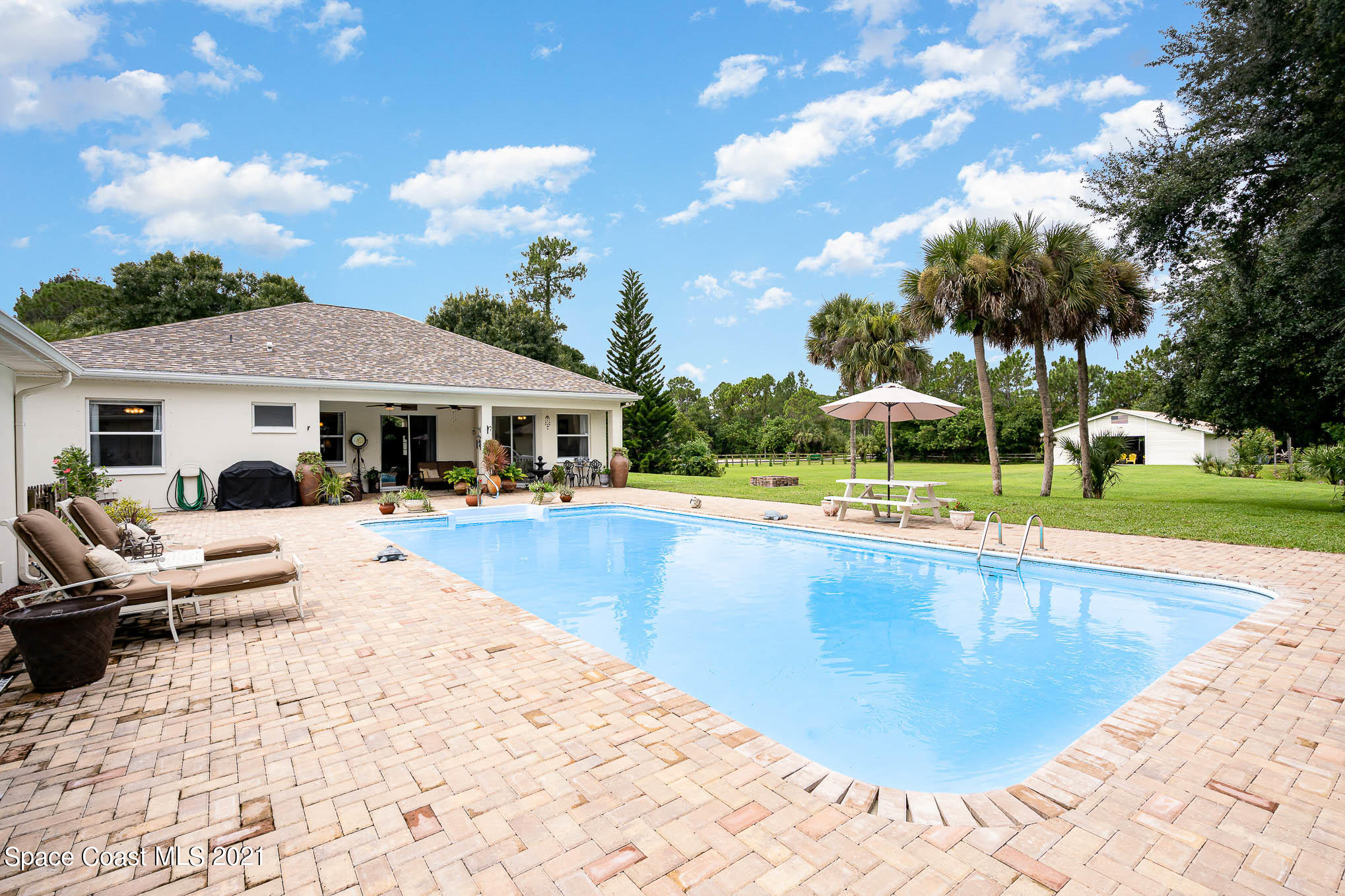 5080 Craig Road Cocoa, FL 32926 - Photo 24 of 41 a view of a house with swimming pool and sitting area