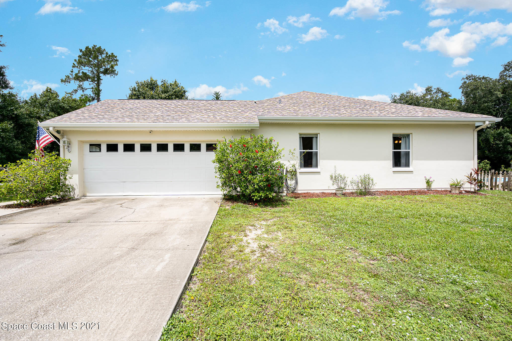 5080 Craig Road Cocoa, FL 32926 - Photo 29 of 41 a front view of a house with garden