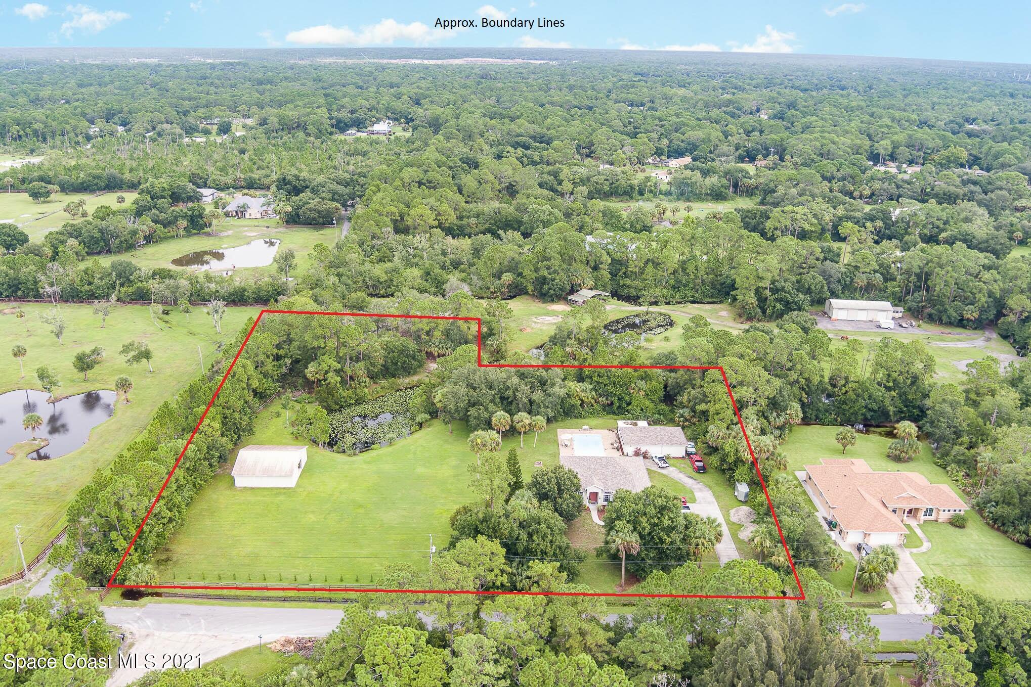 5080 Craig Road Cocoa, FL 32926 - Photo 4 of 41 an aerial view of residential houses with outdoor space