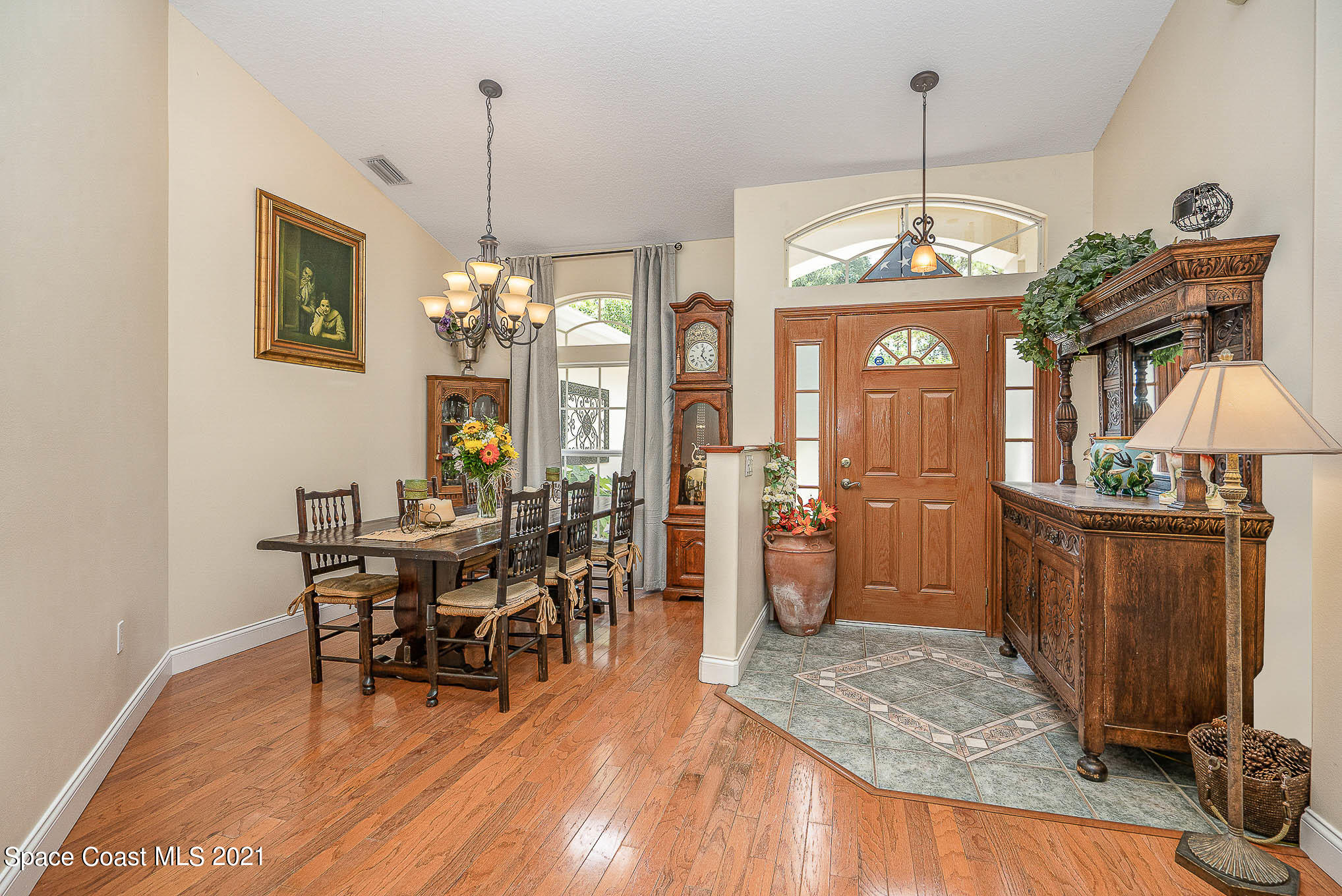 5080 Craig Road Cocoa, FL 32926 - Photo 6 of 41 a view of a dining room with furniture window and wooden floor