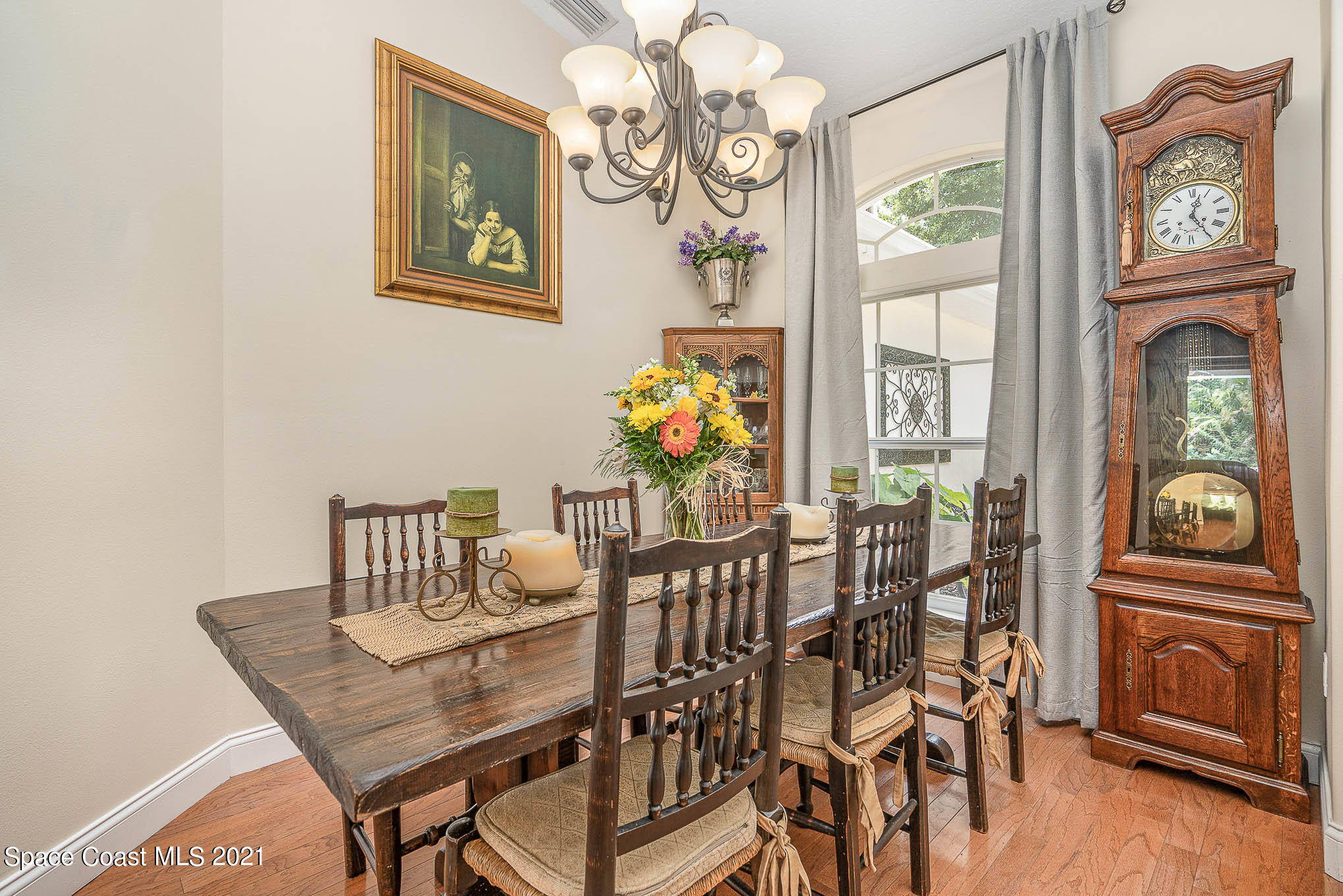5080 Craig Road Cocoa, FL 32926 - Photo 7 of 41 a view of a dining room with furniture wooden floor and chandelier