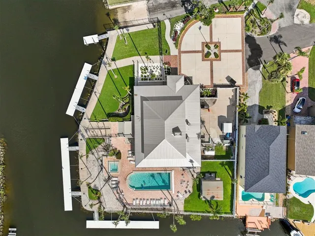 an aerial view of houses with outdoor space