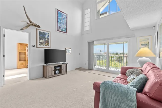 a bedroom with furniture and a flat screen tv