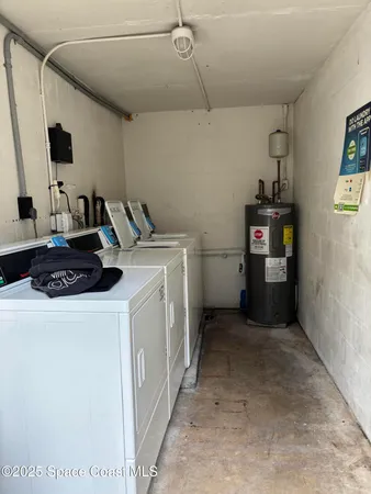 a kitchen with a refrigerator and a stove top oven