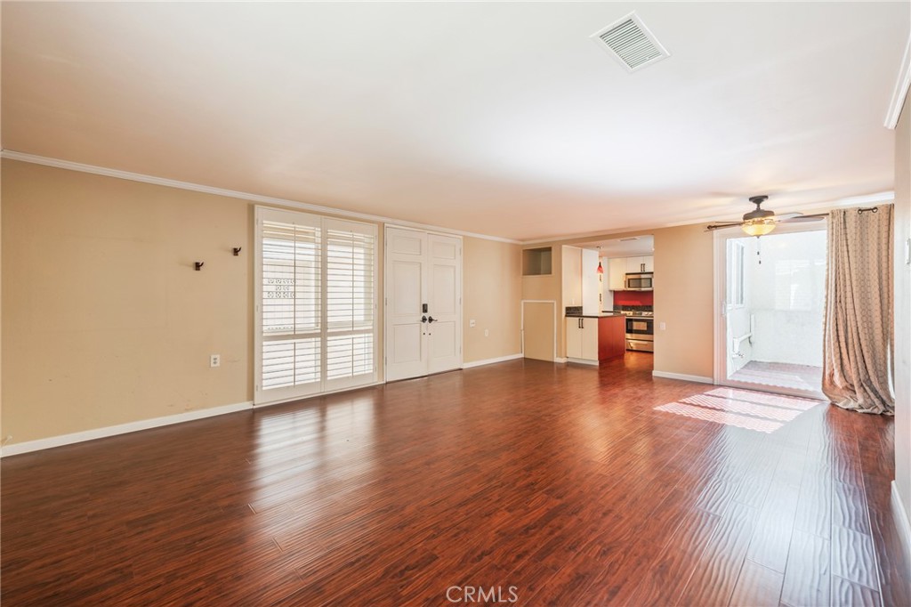 43 Calle Aragon, Unit C Laguna Woods, CA 92637 - Photo 11 of 41 a view of empty room with wooden floor