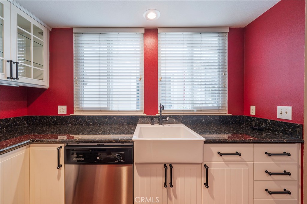 43 Calle Aragon, Unit C Laguna Woods, CA 92637 - Photo 17 of 41 a kitchen with a sink cabinets and window