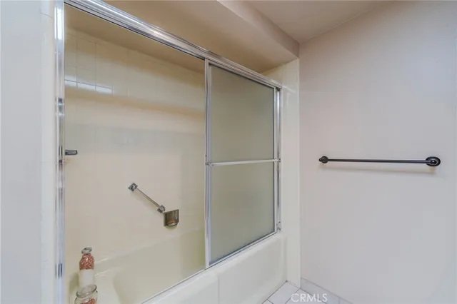 a bathroom with a tub and a shower