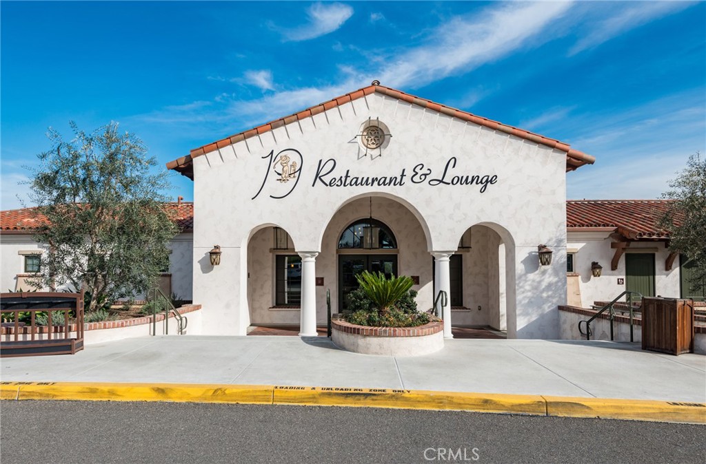 43 Calle Aragon, Unit C Laguna Woods, CA 92637 - Photo 26 of 41 a view of a house with swimming pool