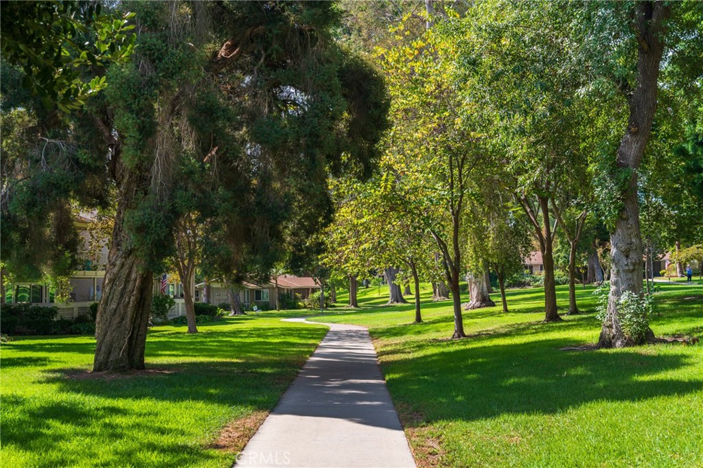 43 Calle Aragon, Unit C Laguna Woods, CA 92637 - Photo 3 of 41 a huge green field with lots of trees