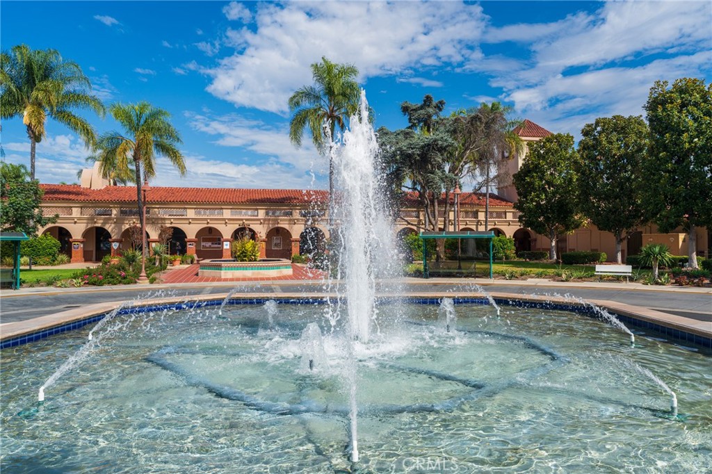 43 Calle Aragon, Unit C Laguna Woods, CA 92637 - Photo 35 of 41 a view of a swimming pool with a yard