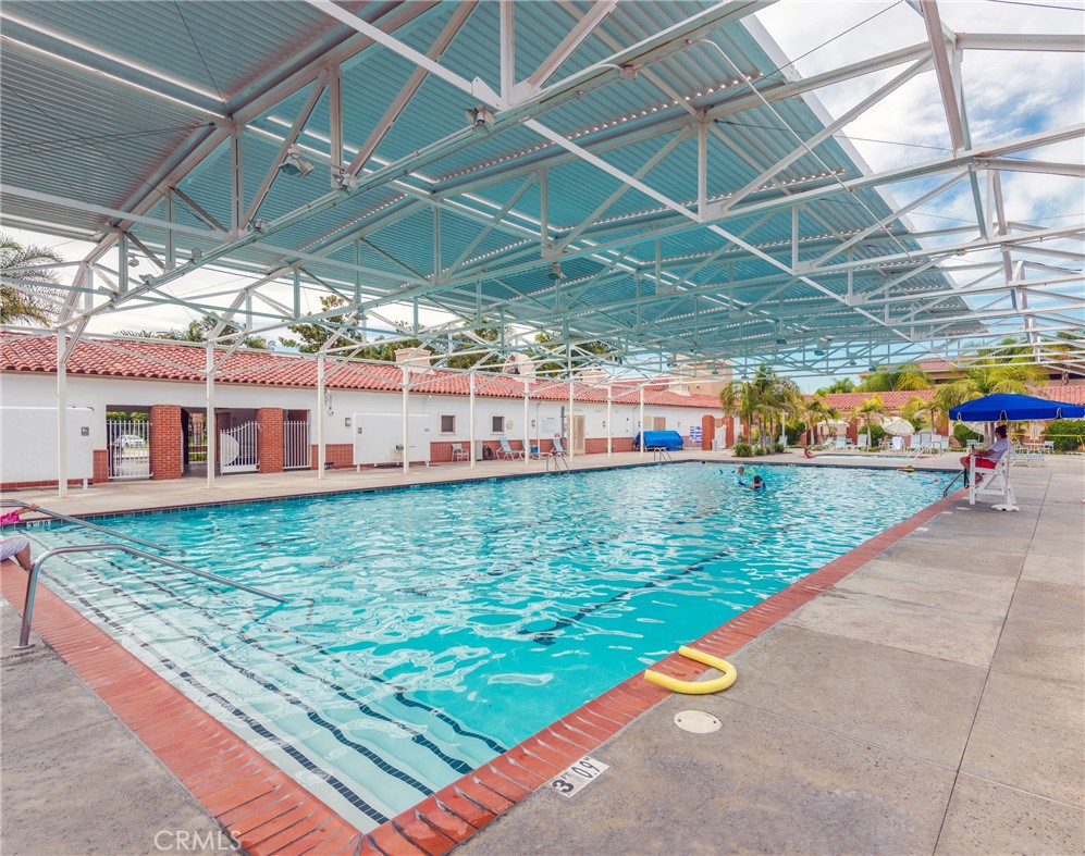 43 Calle Aragon, Unit C Laguna Woods, CA 92637 - Photo 36 of 41 a view of a swimming pool with a patio