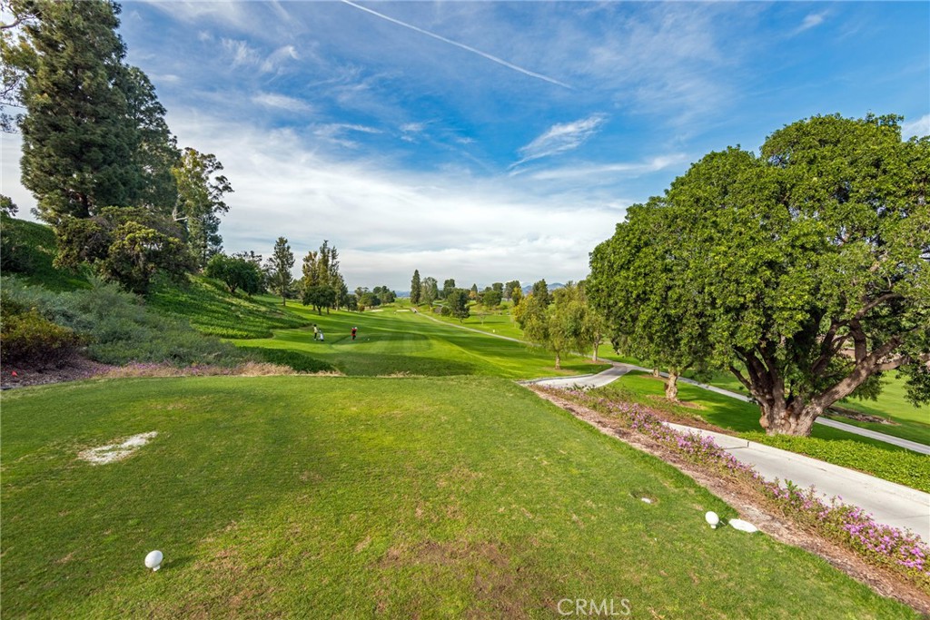 43 Calle Aragon, Unit C Laguna Woods, CA 92637 - Photo 38 of 41 a view of a golf course with a lake