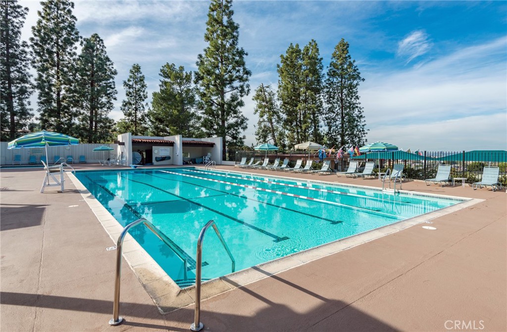 43 Calle Aragon, Unit C Laguna Woods, CA 92637 - Photo 40 of 41 a view of a swimming pool with a patio
