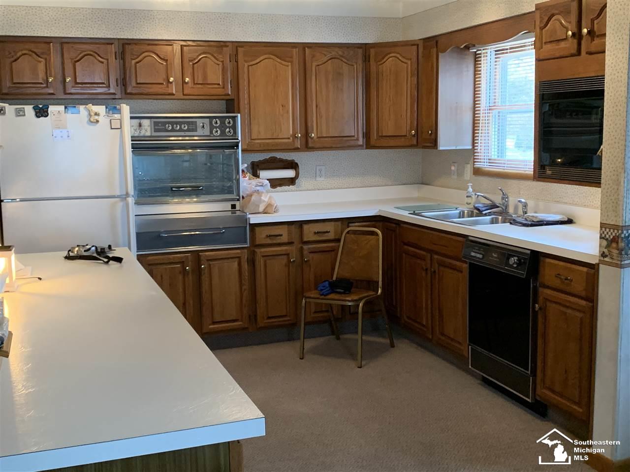 299 Lasalle Road Monroe, MI 48162 - Photo 12 of 14 Lots of countertop space and storage in the kitchen with real wood cabinetry