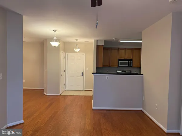 a view of kitchen with wooden floor
