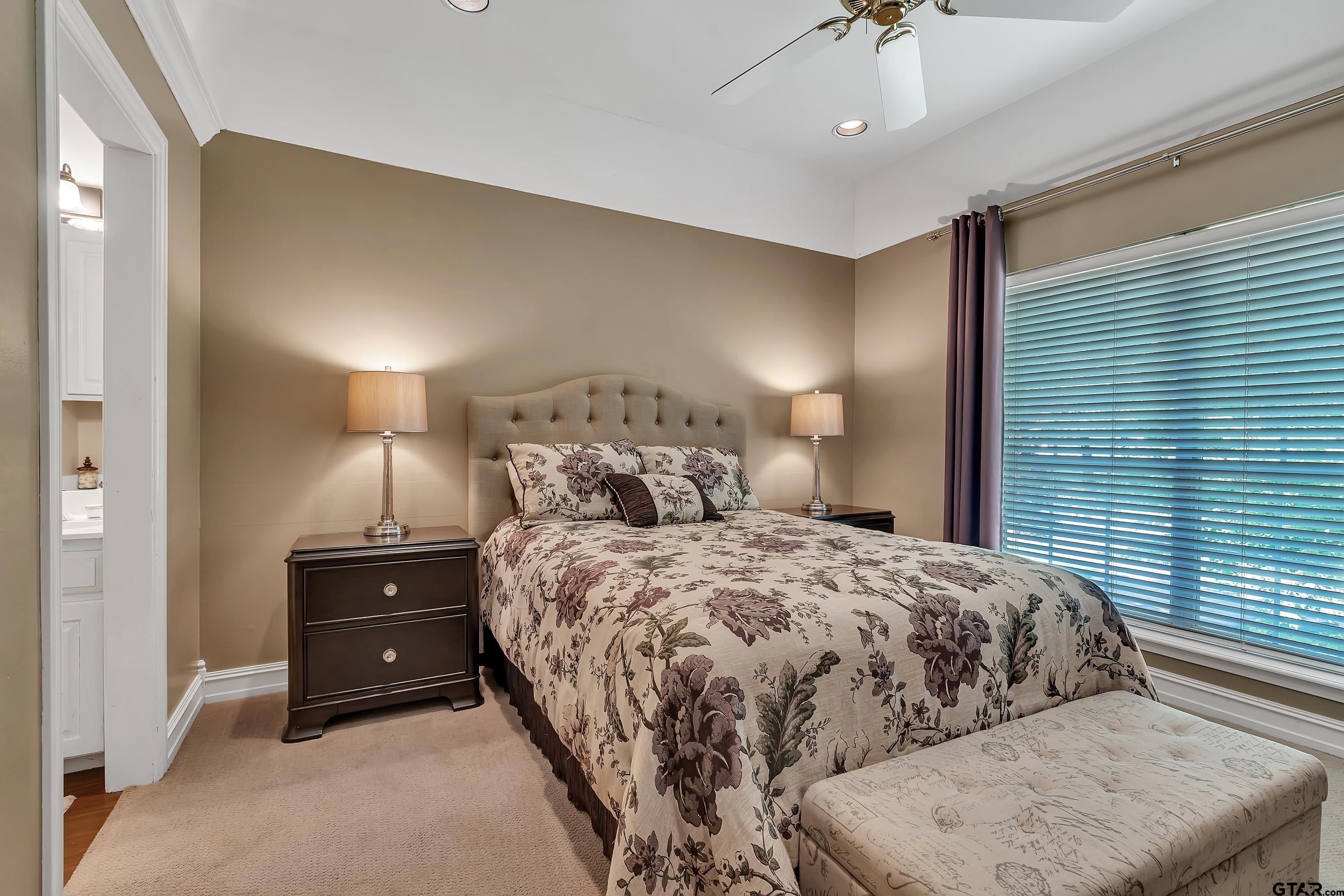 1014 Lovers Lane Longview, TX 75604 - Photo 35 of 45 a bedroom with a bed and a night stand