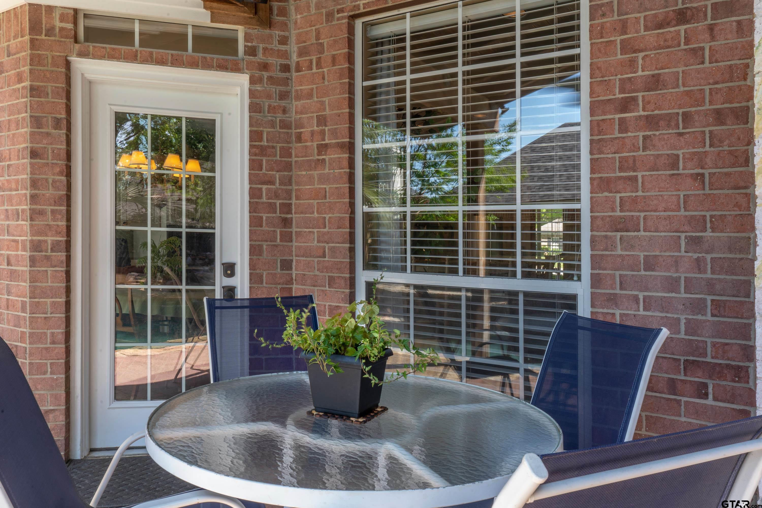 1014 Lovers Lane Longview, TX 75604 - Photo 37 of 45 a view of a chair and table in the porch