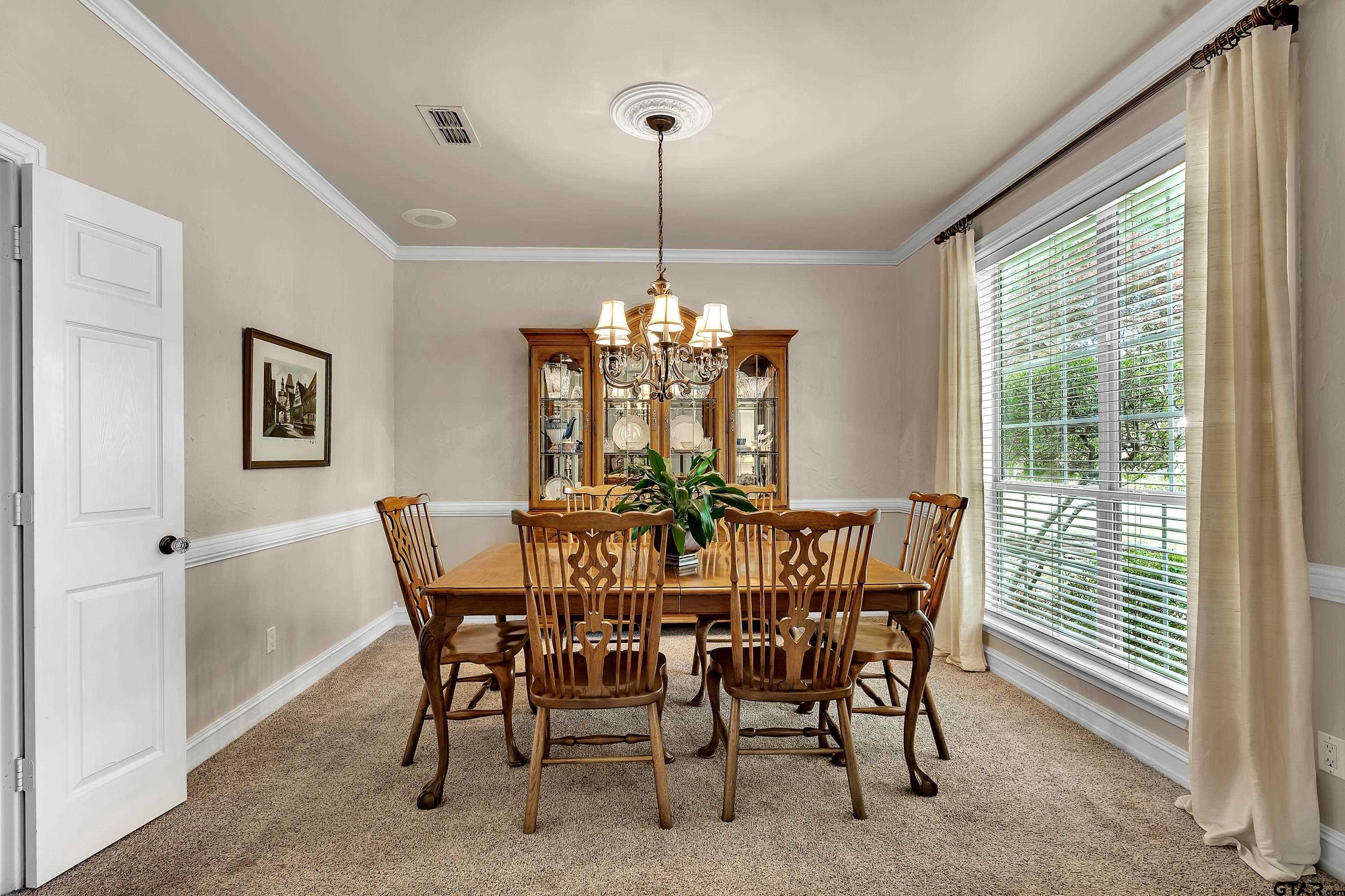 1014 Lovers Lane Longview, TX 75604 - Photo 7 of 45 a view of a dining room with furniture window and outside view
