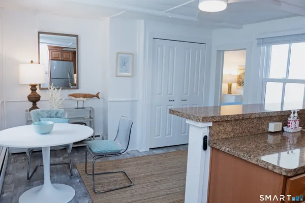 a living room with granite countertop furniture and a sink