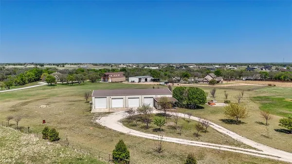 a view of a swimming pool and a yard