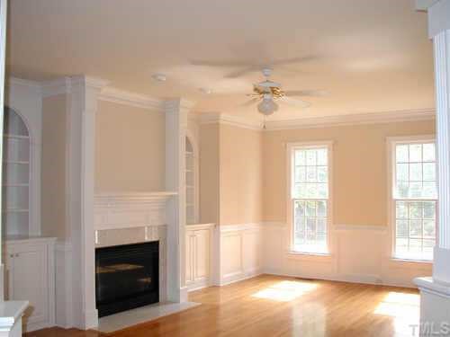 5212 Azure Lane Raleigh, NC 27613 - Photo 4 of 10 a view of an empty room with a fireplace and a window