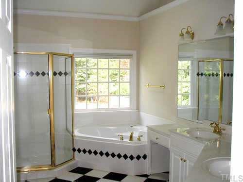 5212 Azure Lane Raleigh, NC 27613 - Photo 10 of 10 a bathroom with a bathtub and a shower