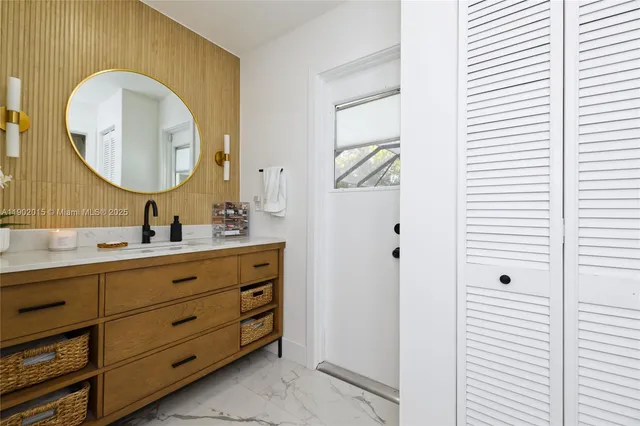 a bathroom with a double vanity sink and a mirror