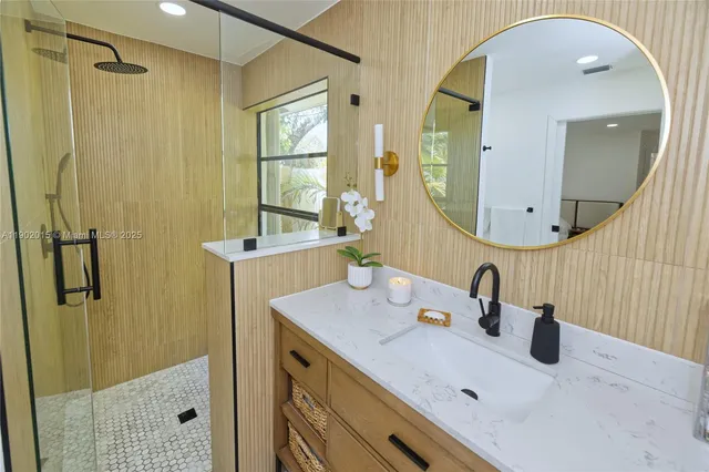a bathroom with a sink and a mirror