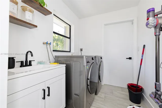 a bathroom with a sink and a washing machine